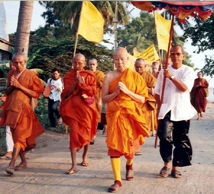 Maha Ghosananda leading the Dhammayietra peace march, surrounded by monks and followers walking for peace across Cambodia